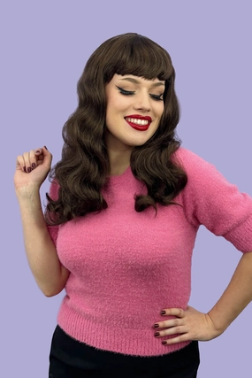 Brown 1950s pinup style wig, with long waves and a short fringe: Rosie