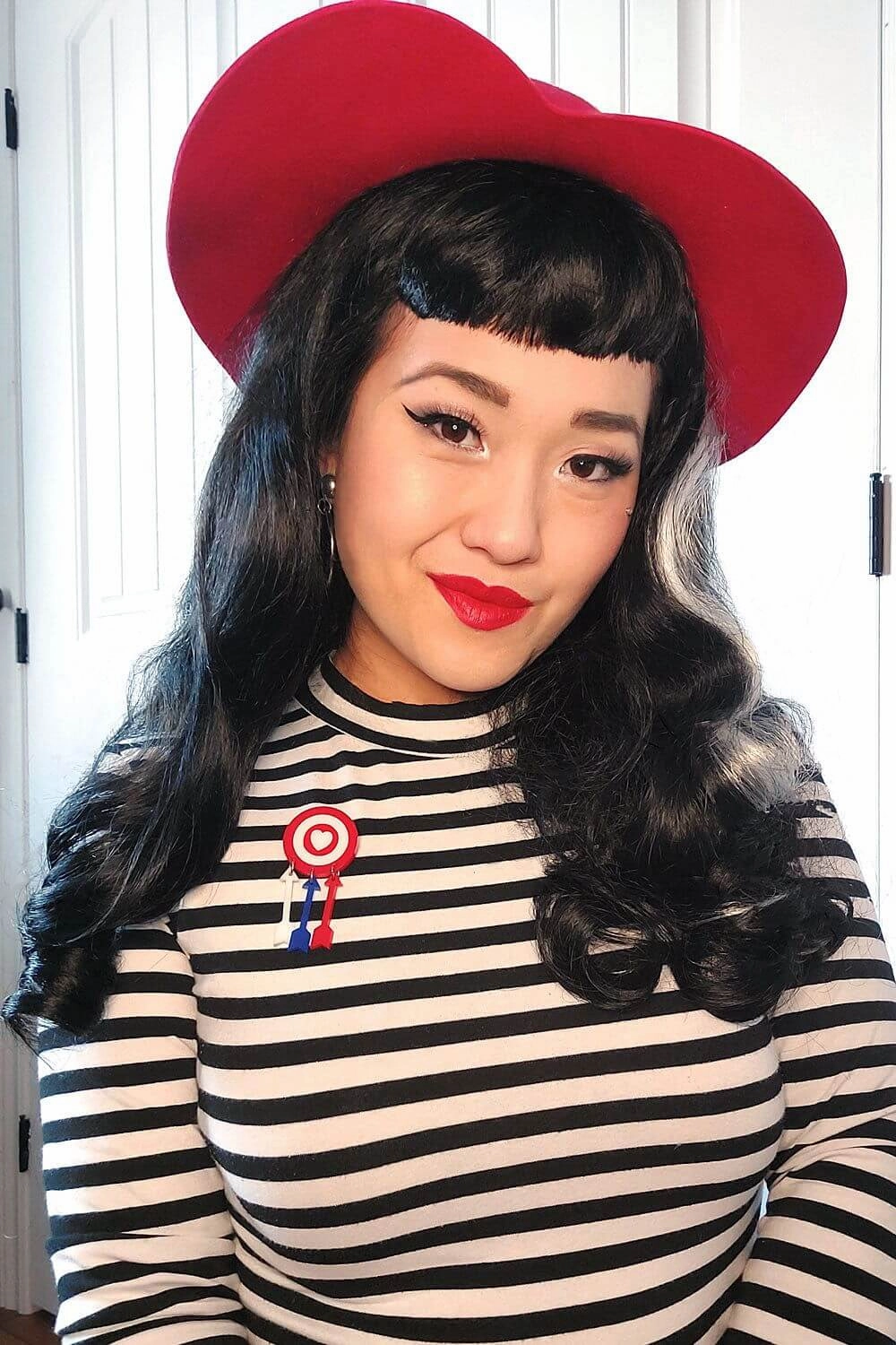 Long black 1950s pin up style wig with platinum streak and retro fringe: Michelle