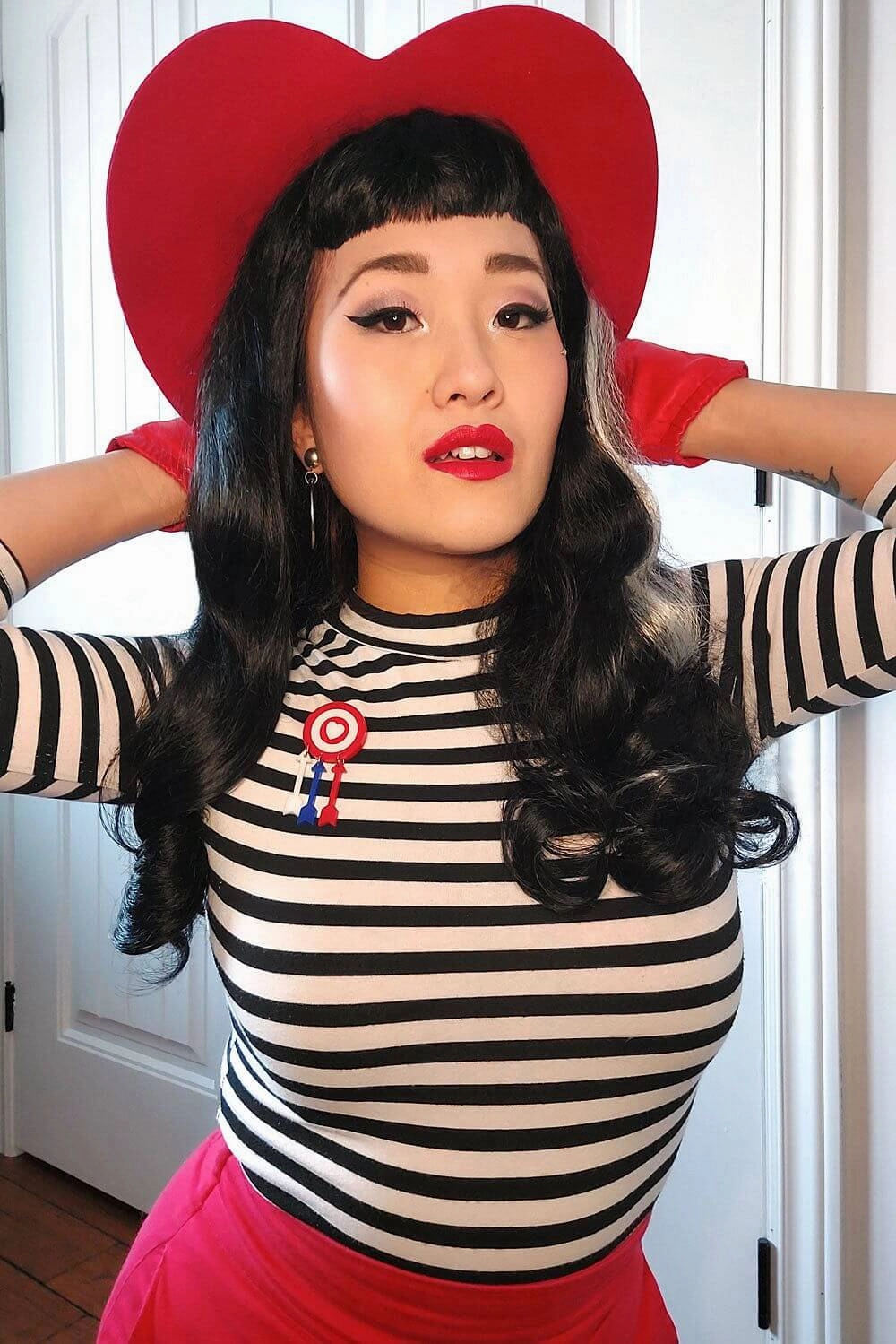 Long black 1950s pin up style wig with platinum streak and retro fringe: Michelle
