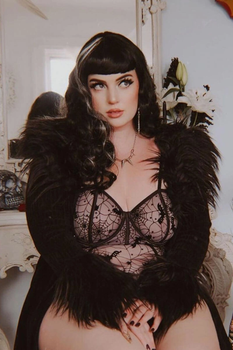 Long black 1950s pin up style wig with platinum streak and retro fringe: Michelle