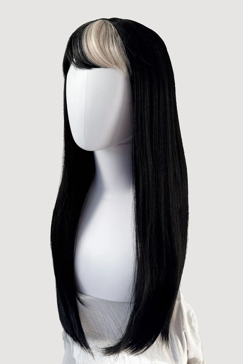 Long, black, straight wig with platinum fringe streak and retro, straight fringe: Imogen