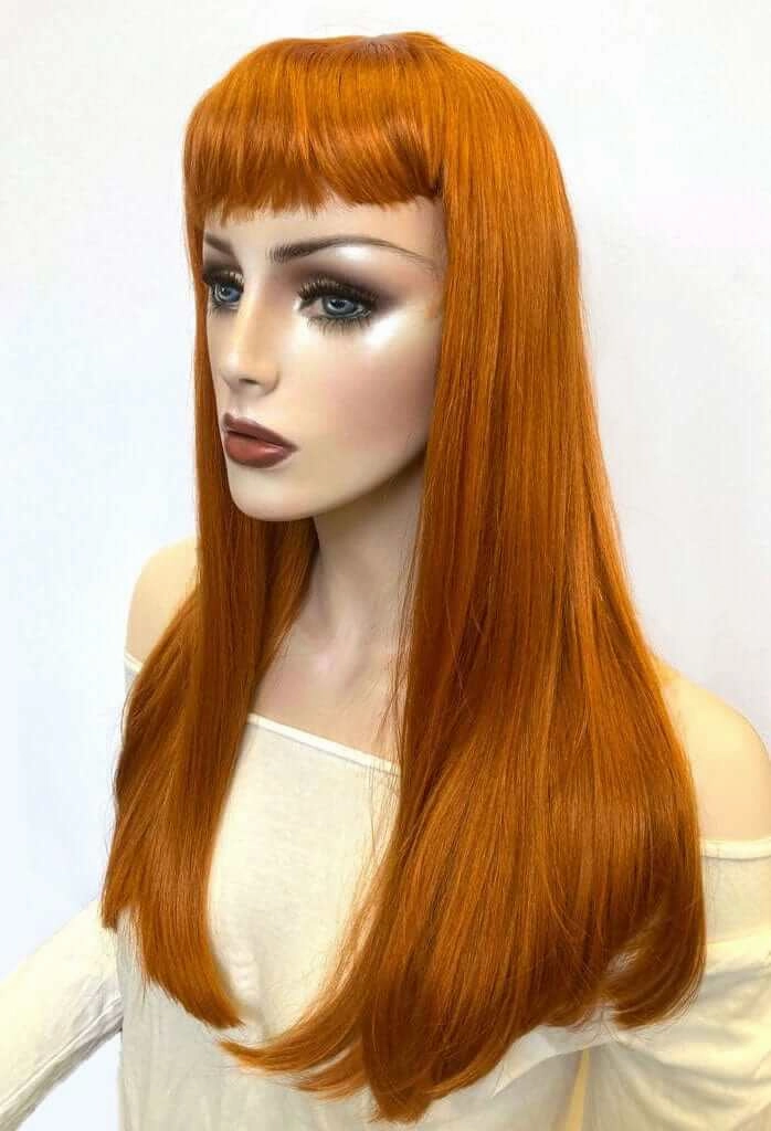 Long ginger wig with straight hair and a short, straight fringe: Daphne