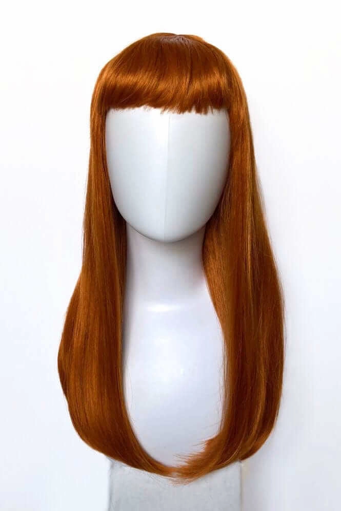 Long ginger wig with straight hair and a short, straight fringe: Daphne