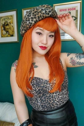 Long ginger wig with straight hair and a short, straight fringe: Daphne